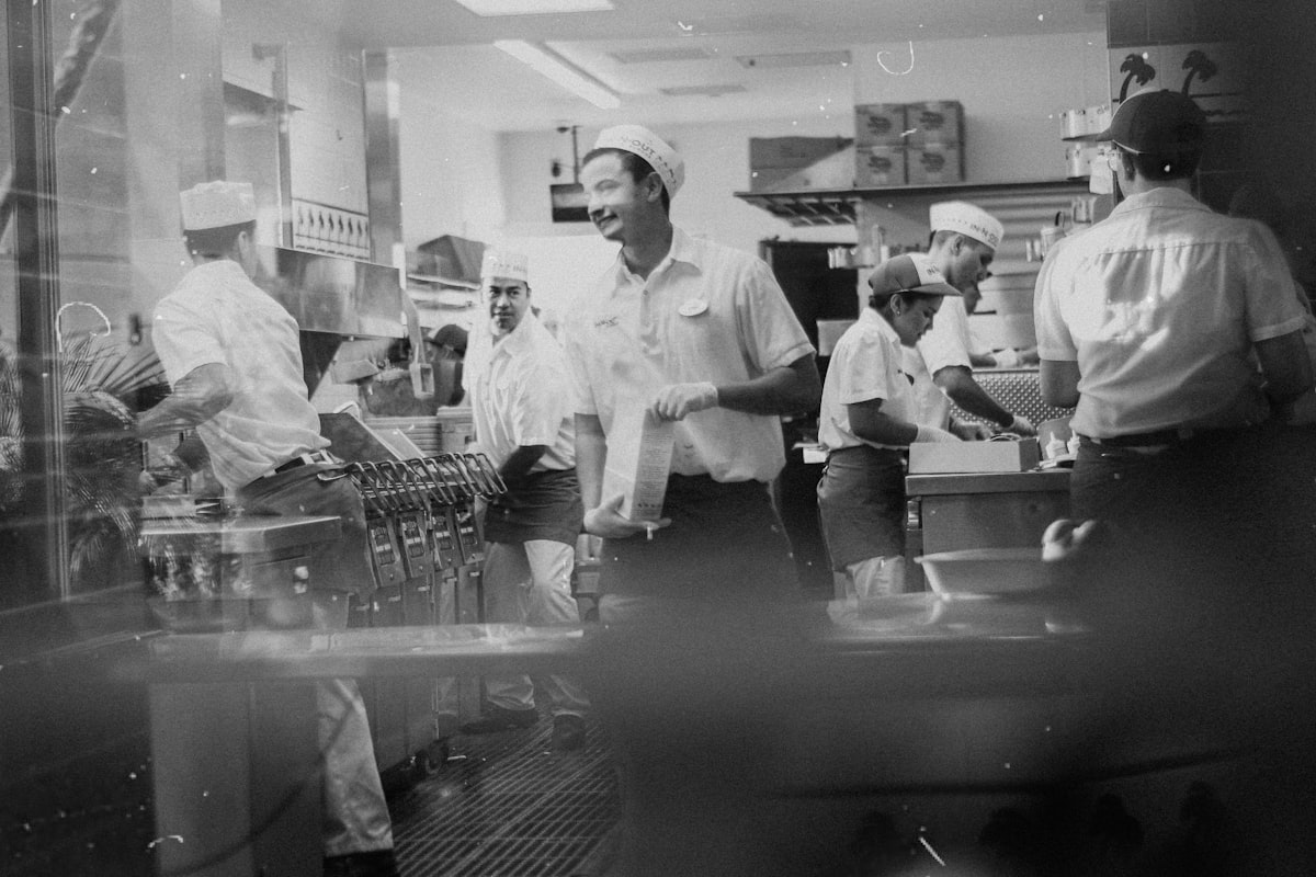 Students learning balanced cooking techniques in our kitchen classroom
